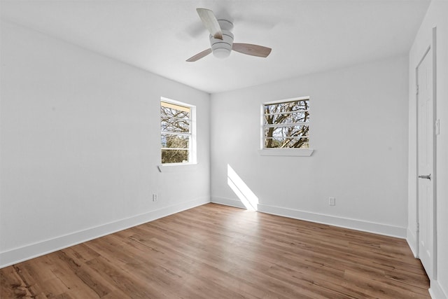 spare room featuring ceiling fan and hardwood / wood-style flooring