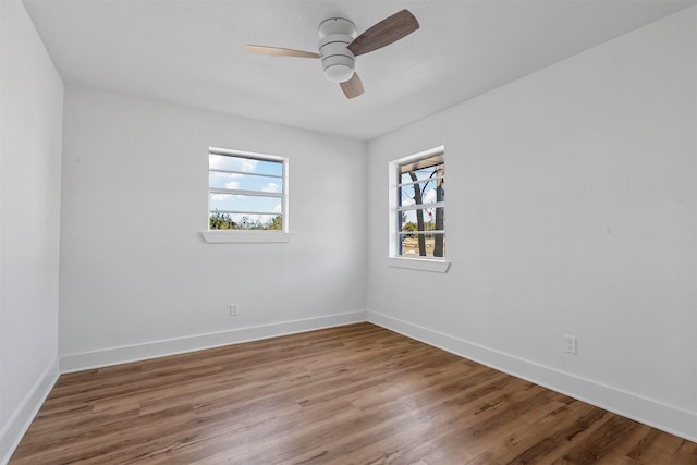 spare room featuring hardwood / wood-style flooring and ceiling fan