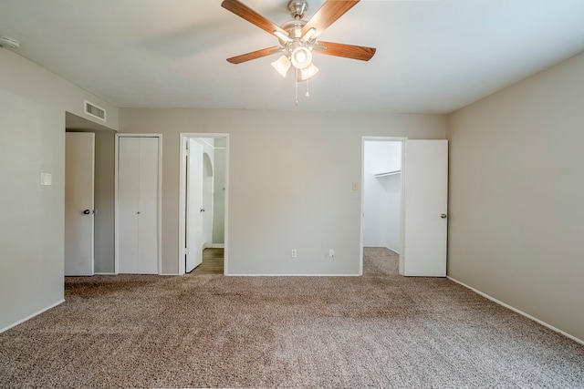 unfurnished bedroom with carpet floors and ceiling fan