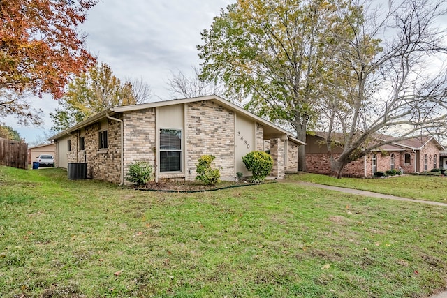 view of property exterior featuring a yard and central AC