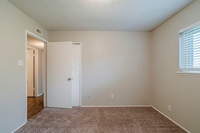 view of carpeted spare room