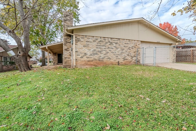 view of property exterior with a lawn