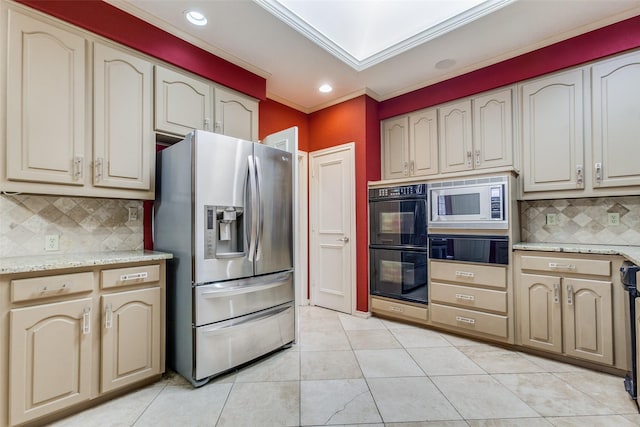 kitchen with tasteful backsplash, light tile patterned floors, and stainless steel appliances