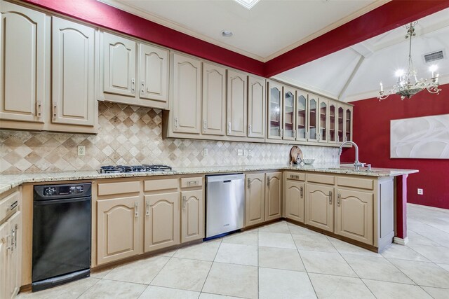 kitchen with sink, stainless steel appliances, tasteful backsplash, pendant lighting, and light tile patterned floors