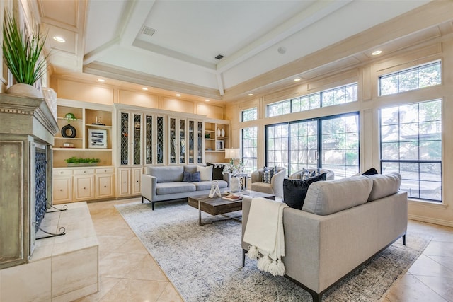 tiled living room featuring beam ceiling and a towering ceiling