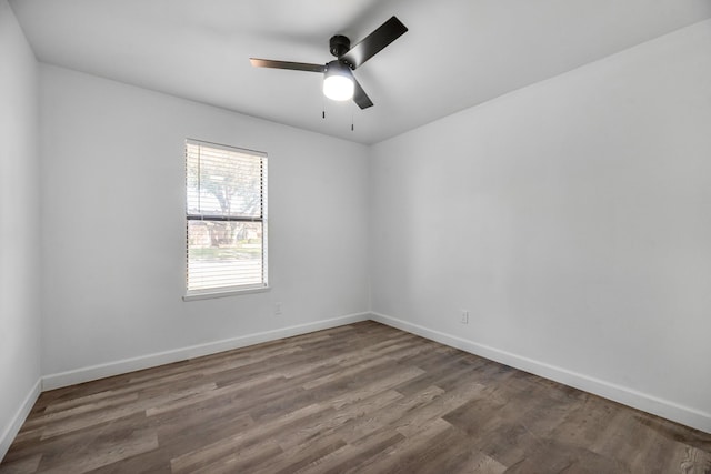 empty room featuring hardwood / wood-style floors and ceiling fan