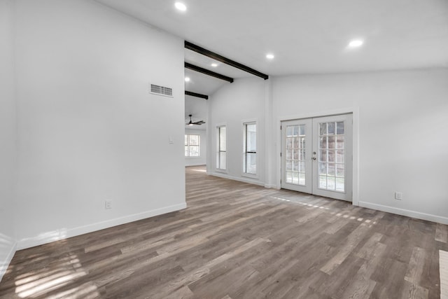 empty room featuring beam ceiling, ceiling fan, french doors, high vaulted ceiling, and wood-type flooring