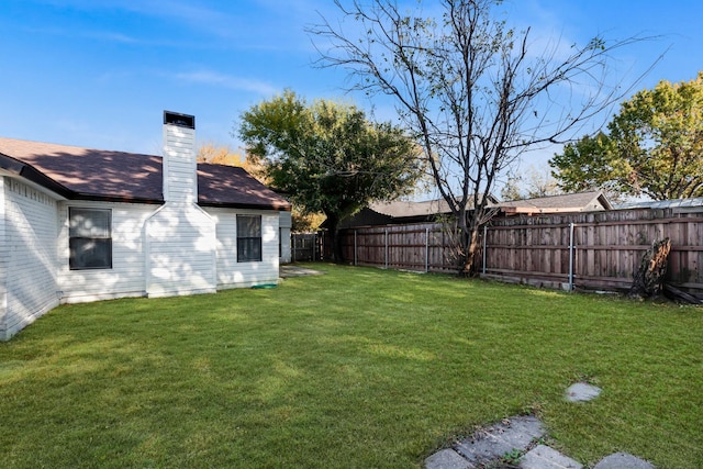 view of yard with a fenced backyard