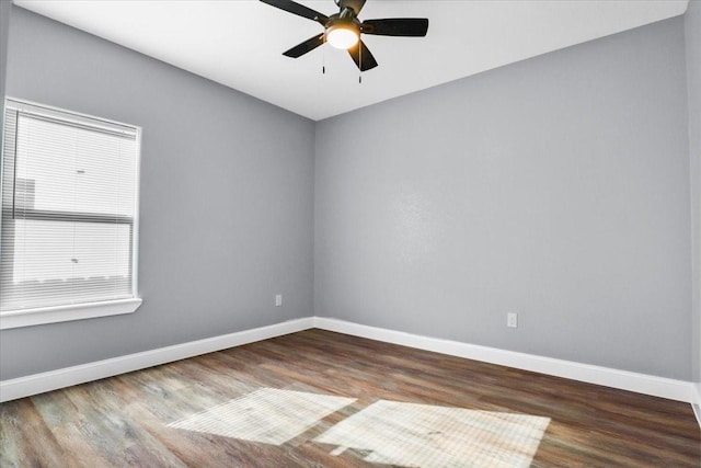 spare room featuring ceiling fan and hardwood / wood-style flooring