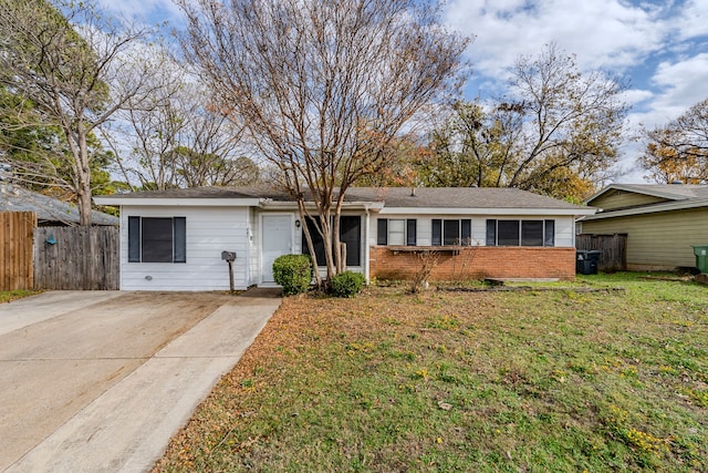 ranch-style house with a front yard