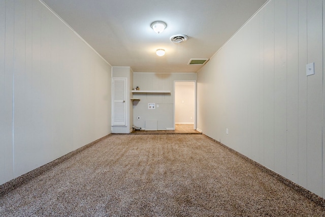 unfurnished living room with carpet floors and ornamental molding