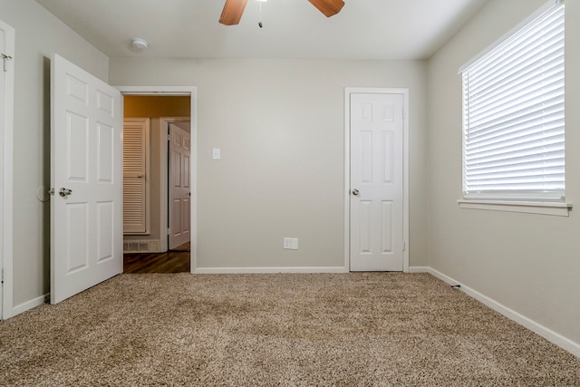 unfurnished bedroom with carpet and ceiling fan