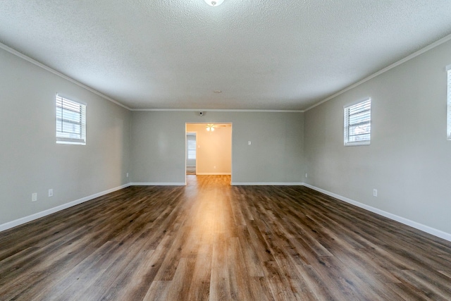 unfurnished room featuring dark hardwood / wood-style floors, crown molding, and a textured ceiling