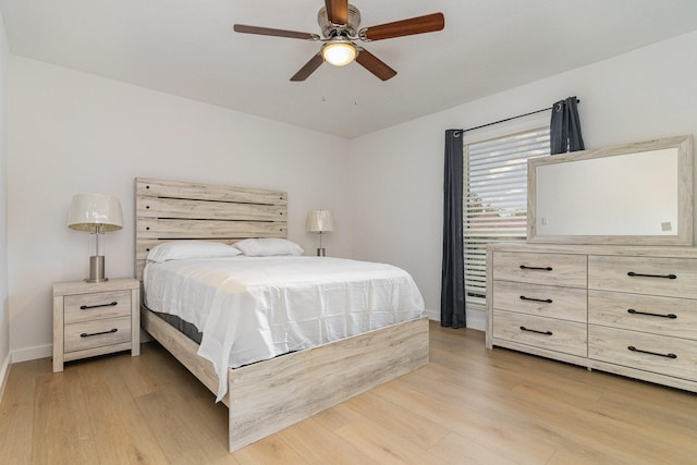 bedroom featuring light hardwood / wood-style floors and ceiling fan