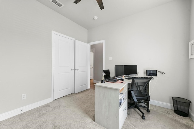 carpeted office featuring ceiling fan