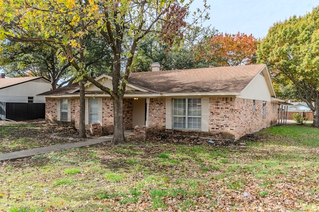 single story home featuring a front yard