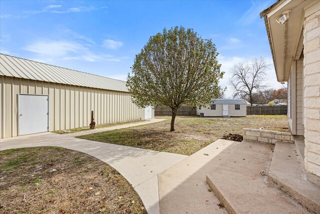 206 N Bouldin St, Hamilton, TX 76531 - view of yard with an outbuilding and a patio