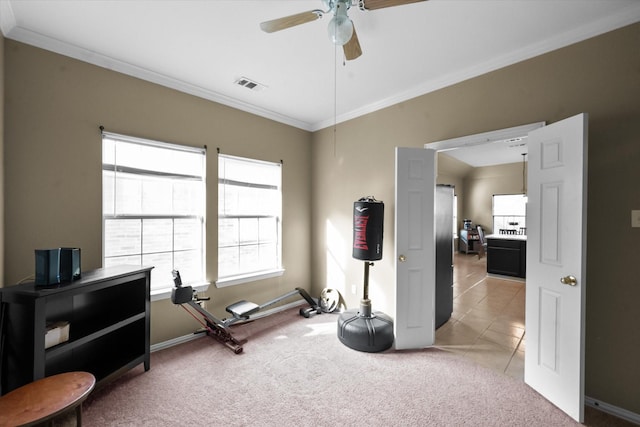 miscellaneous room featuring ceiling fan, ornamental molding, and light carpet