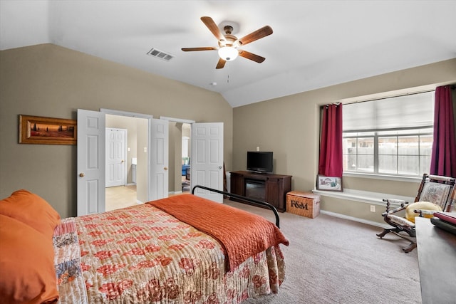 bedroom featuring lofted ceiling, light carpet, and ceiling fan