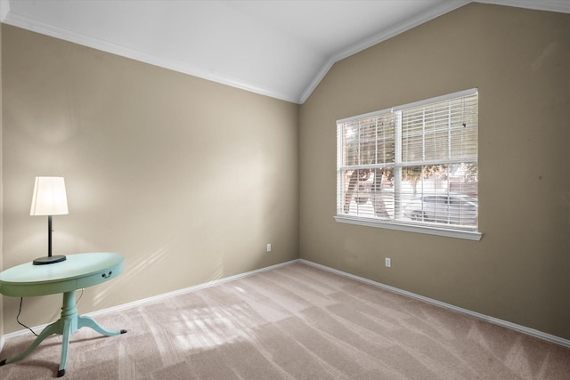 unfurnished room featuring vaulted ceiling, light colored carpet, and crown molding