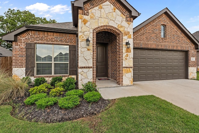 221 Gardenia Dr, Azle, TX 76020 - french country inspired facade with brick siding, an attached garage, stone siding, and concrete driveway