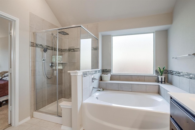 bathroom with shower with separate bathtub, vanity, tile patterned floors, and lofted ceiling