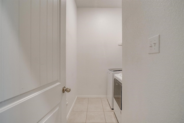 221 Gardenia Dr, Azle, TX 76020 - laundry area featuring independent washer and dryer, light tile patterned floors, and baseboards