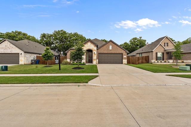 221 Gardenia Dr, Azle, TX 76020 - french country home with stone siding, a garage, driveway, and brick siding