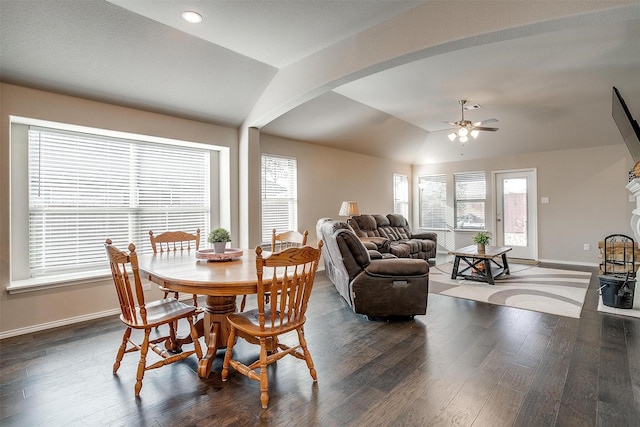 dining room featuring dark wood-type flooring, ceiling fan, and lofted ceiling