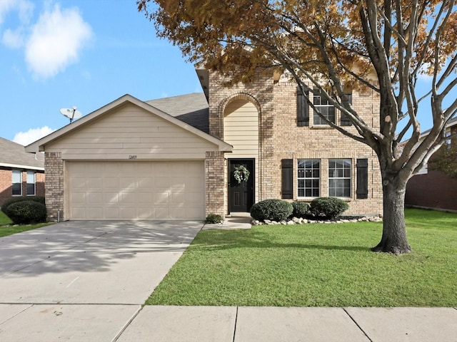 view of front of house with a garage and a front yard