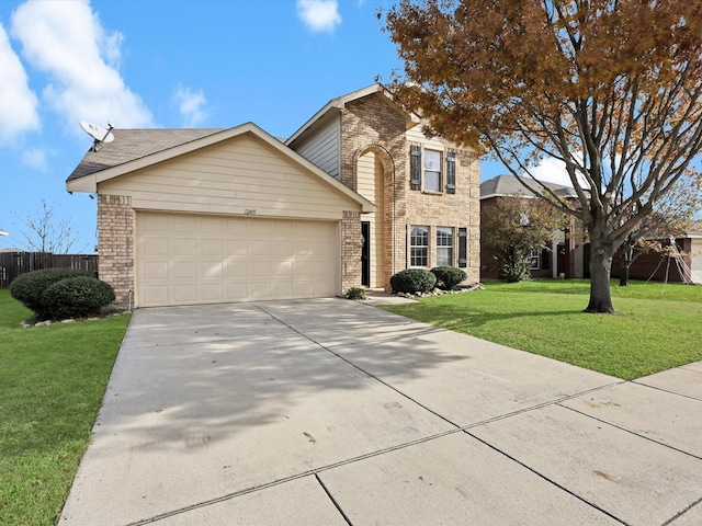 view of front of house with a front yard and a garage