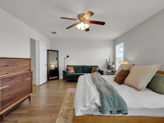 bedroom featuring hardwood / wood-style floors and ceiling fan