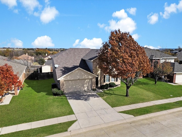 view of front of house with a front yard and a garage