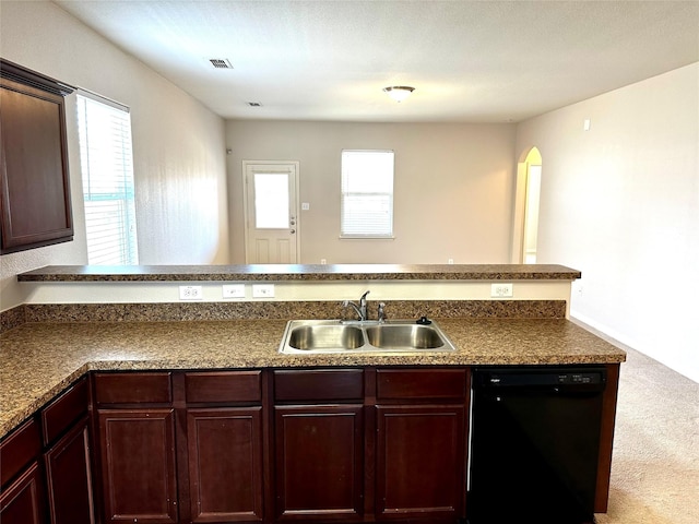 kitchen featuring carpet flooring, dishwasher, kitchen peninsula, and sink