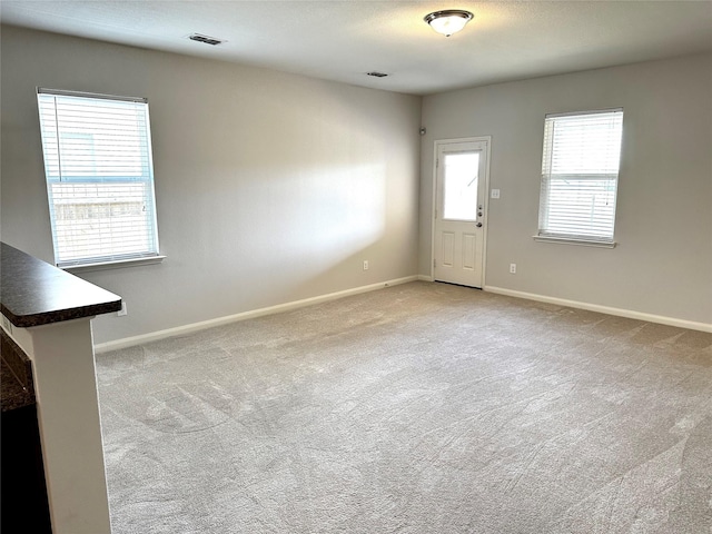 interior space featuring light colored carpet