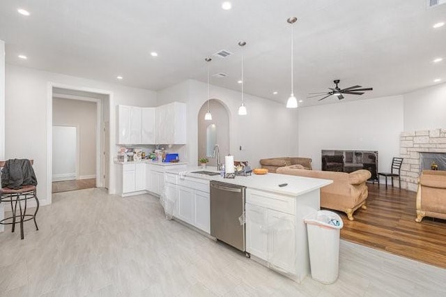 kitchen featuring white cabinets, pendant lighting, stainless steel dishwasher, and ceiling fan