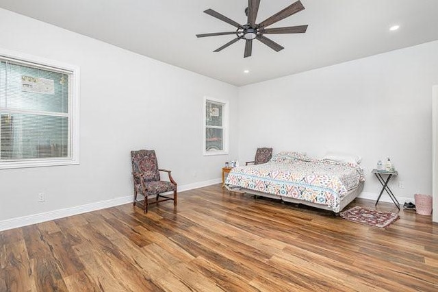 bedroom with wood-type flooring and ceiling fan