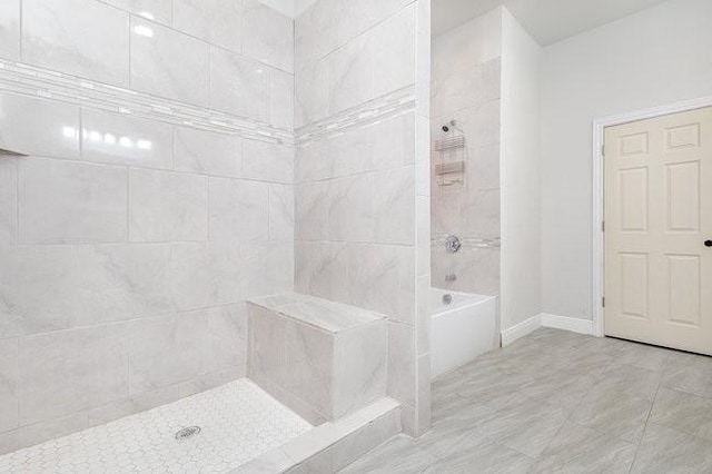 bathroom with shower with separate bathtub