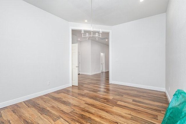 spare room with wood-type flooring