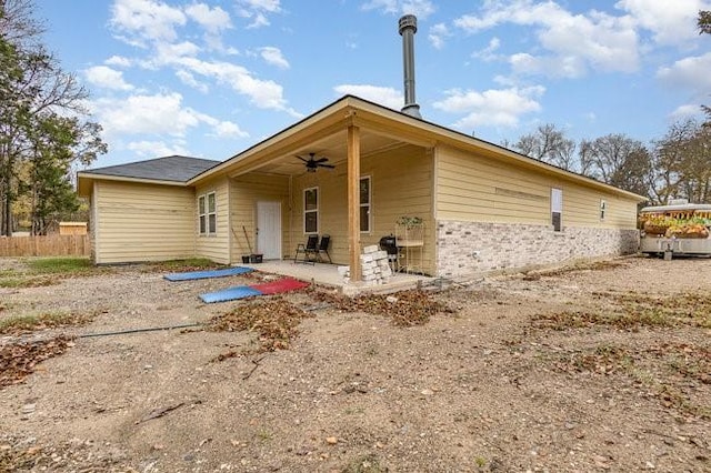 back of house featuring ceiling fan and a patio area