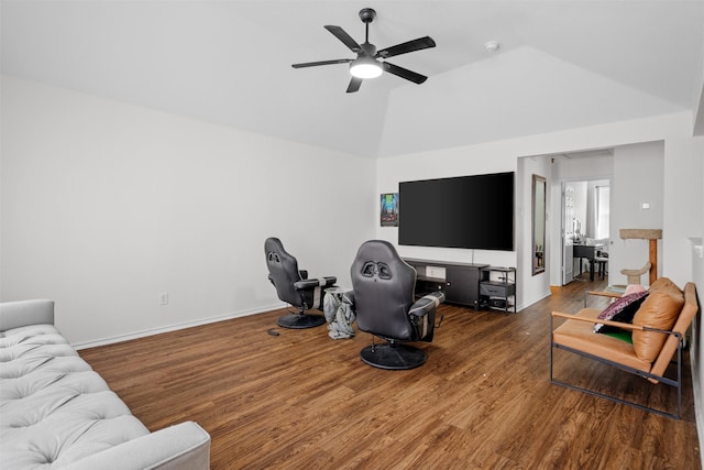 living room featuring hardwood / wood-style flooring, lofted ceiling, and ceiling fan