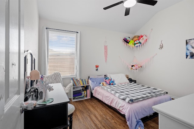 bedroom with dark hardwood / wood-style flooring, lofted ceiling, and ceiling fan