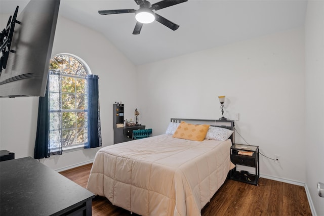 bedroom featuring lofted ceiling, dark wood-type flooring, and ceiling fan