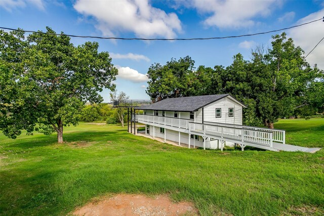 view of yard with a wooden deck