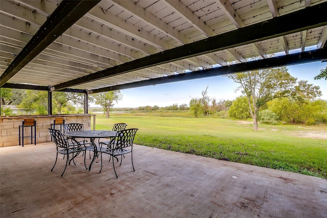 view of patio featuring an outdoor bar