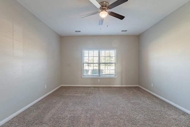 empty room featuring carpet flooring and ceiling fan