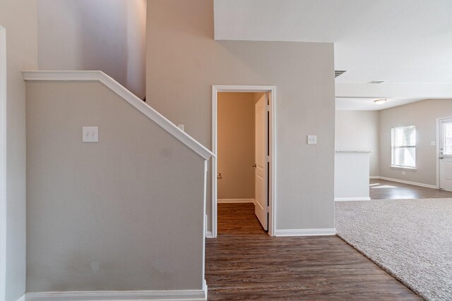 stairway featuring hardwood / wood-style flooring