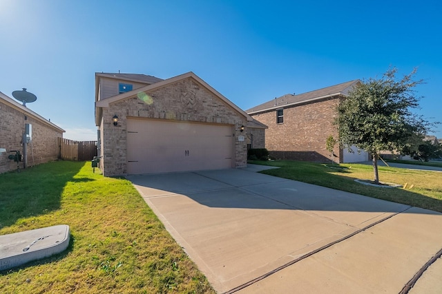 view of front of house with a front yard, an outbuilding, and a garage