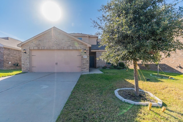 view of front facade with a front yard and a garage