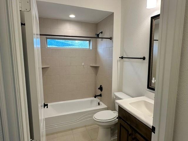 full bathroom featuring toilet, vanity, and tiled shower / bath